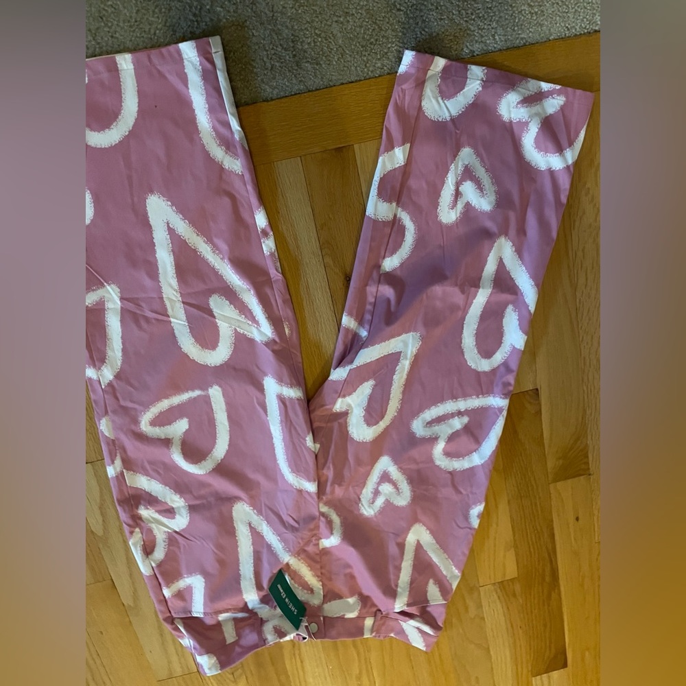 Shein button down pants.    Pink with white hearts